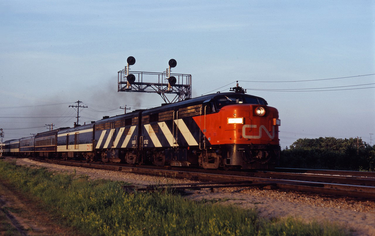 Although I don't have a written record, what appears to be train No. 147 for Windsor rolls through Aldershot East behind a matched FPA4/FPB4 set on a pleasant summer's evening in July 1968.