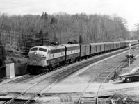 Another view of the last run of CP #21 "The Chicago Express", a Montreal-Toronto-Windsor-Detroit full-service train that featured parlor and dining car service as well as a through sleeping car, the day before it and train #22 were replaced with "Dayliner" service using RDCs. CP FP9 1412 leads an F7B and #21's passenger consist through Campbellville, about to cross Guelph Line crossing as traffic waits for the train to pass.
<br><br>
Other shots of the train on the same day:<br>
Head-end going away shot: <a href=http://www.railpictures.ca/?attachment_id=25072><b>http://www.railpictures.ca/?attachment_id=25072</b></a><br>
Tail-end going away shot: <a href=http://www.railpictures.ca/?attachment_id=25358><b>http://www.railpictures.ca/?attachment_id=25358</b></a><br>
Stopped at Guelph Junction: <a href=http://www.railpictures.ca/?attachment_id=24875><b>http://www.railpictures.ca/?attachment_id=24875</b></a>