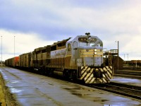 A CP freight train arrives at North Bay, Ontario behind a GP35/GP30 duo (5022/5000) for a crew change on a very rainy, dull, and dreary September 1st 1969.  Location is an approximation.  