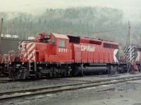 A nice October day in Revelstoke BC! Lots of liquid sunshine and a good hardhat to keep your head dry. Catching locomotives being fulled was not something most people got to see and I was lucky enough be there at the right time. I did what I normally would have done. I just stayed well back and took photographs. Very seldom did I ever talk to a CP employee, I just kept my pass handy and observed. Too this day I have no idea how much fuel locomotives like CP 5711 would have carried in their tanks, nor do I know how far they went with a full tank. Especially in the mountains. 