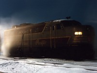 Surrounded by leaking steam, Canadian Pacific FPA2 4083 idles the night away at the TH&B's Chatham Street roundhouse in Hamilton. Having brought CP's part of the Toronto Hamilton & Buffalo line train to New York over to Hamilton mid-evening, it will take the New York-Toronto train back to Toronto first thing in the morning, trading off with TH&B or NYC power at the Hunter Street station.