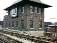 Here's a view of the old Cherry St. Interlocking Tower that one would be hard pressed to get today. This structure was built in 1930-31 and is due to be decommissioned in 2020 when Metrolinx upgrades the signal system. Also, future plans for track expansion means the old building's life at this location is very limited. Mainly because it is in the way.  However it was designated Metrolinx Heritage Property of Provincial Significance in 2013, so the only recourse is to move it. And that is the plan.This view, if possible without being run down or arrested :o)these days would show a couple of tall glass condo towers crowding the background. Such is life in the Distillery District.