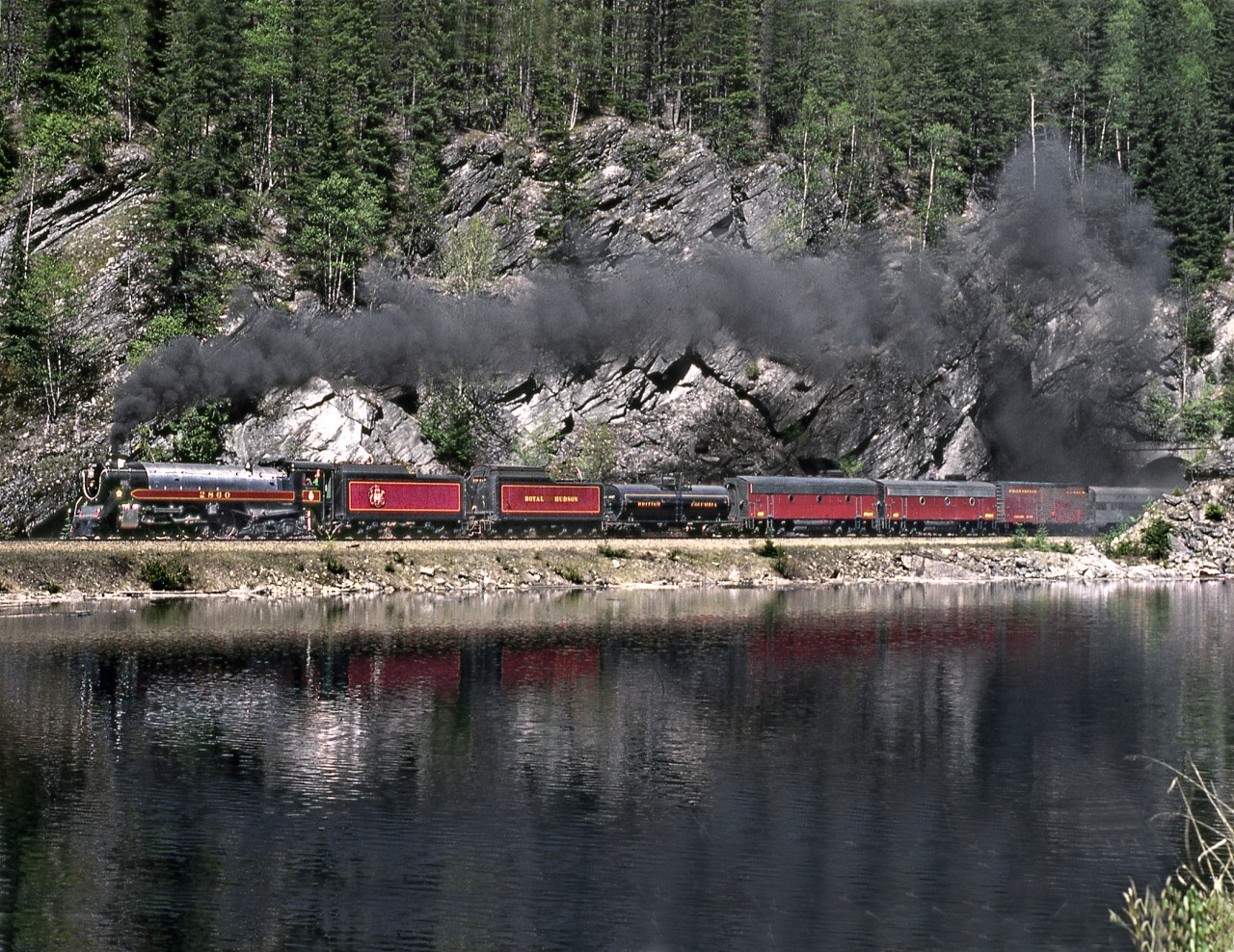 Provincially owned ex CP Royal Hudson 2860,returning from a tourist promotion tour of the U.S. west coast summits Eagle Pass of the Monashee Mountains west of Revelstoke.
