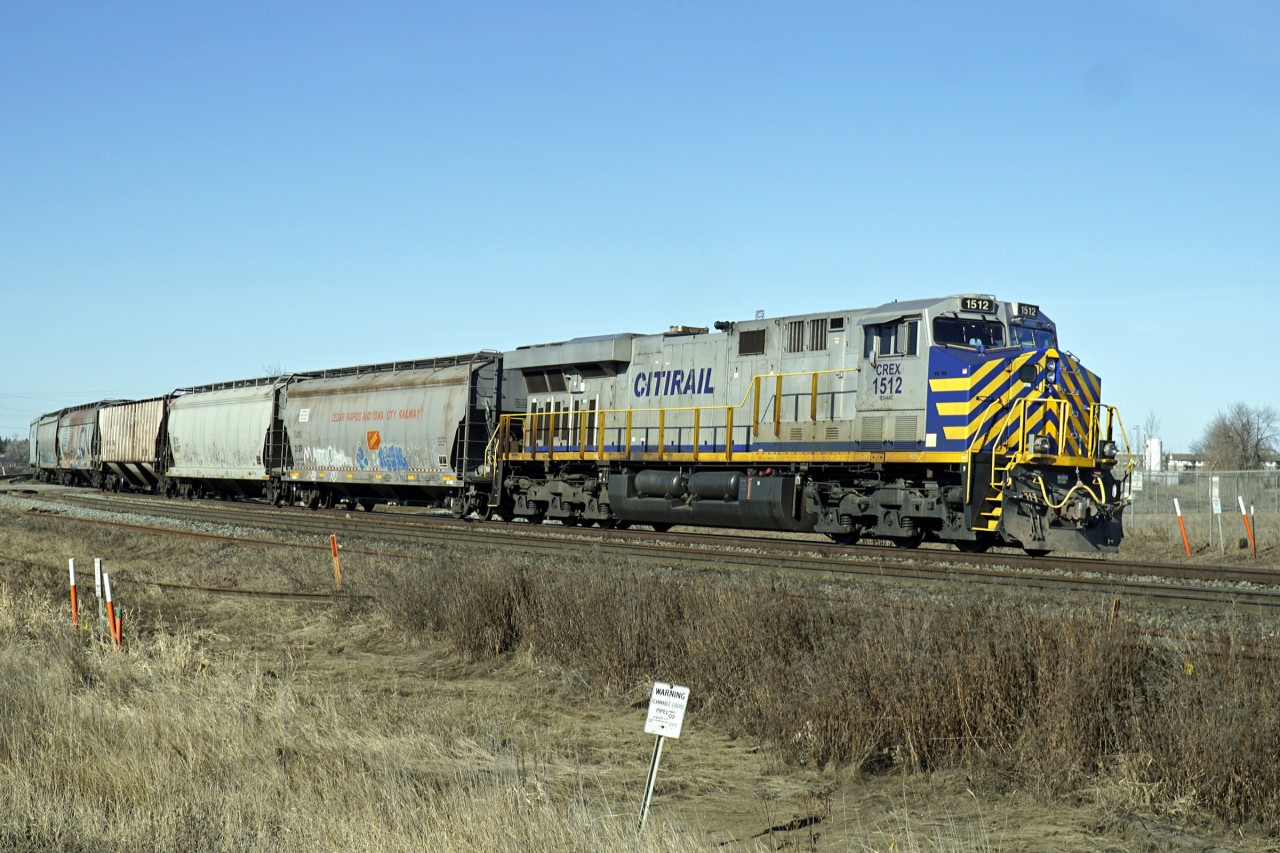 ES44AC CREX 8065 is the rear DP on this westbound grain approaching Edmonton.