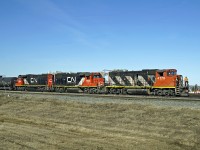 GP38-2(W) CN 4778 and GP38-2s 7503 and 7530 are switching oil tank cars at the east end of CN's Clover Bar yard.