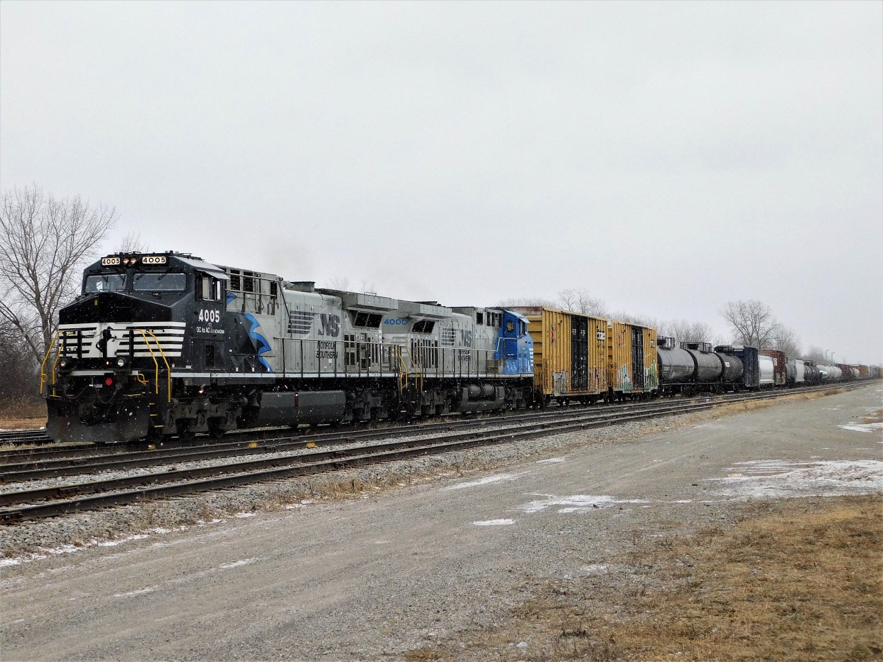 NS C93 slowly moves through the Fort Erie yard on the CN Stamford Sub with two of NS' DC to AC Conversion livery AC44C6Ms on a bitterly cold afternoon. These were the early hours of a pretty nasty lake effect blizzard that soon layered the ground with at least 4 inches of snow.