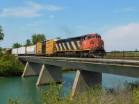 CN L531 crosses over the Welland River in Port Robinson on its way to Buffalo, NY with GE C40-8M #2407 in the lead.