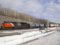 With an SD70M-2 up front and another 101 cars back (CN 8874 and CN 8881), a 141-car CN 305 slowly departs Turcot Ouest after a quick crew change, with the inbound crew performing a roll-by inspection on the train.