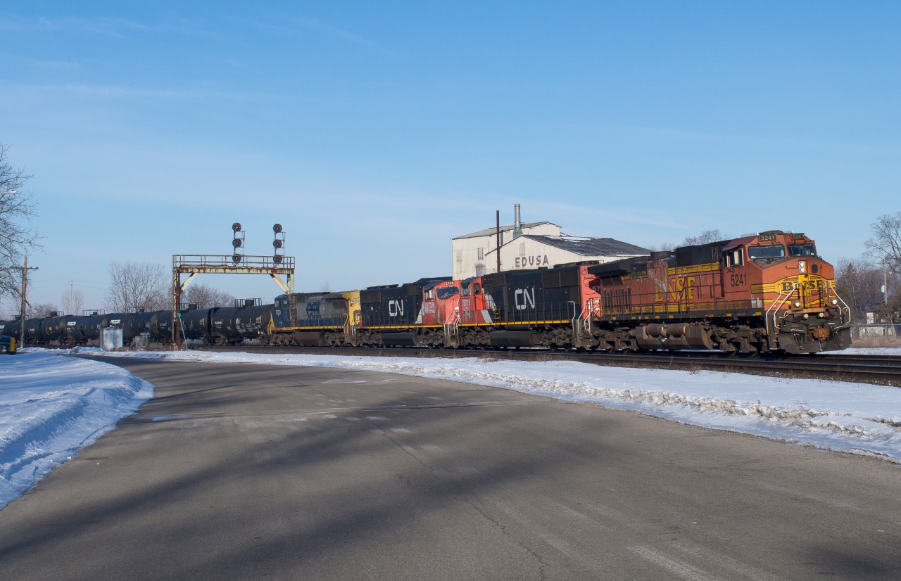 CN 396 blasts through Paris Junction with BNSF 5241 on the point.  This train came into Sarnia with the BNSF 3rd but issues with their lead SD75i resulted in a shuffle of power and a foreign leader.  It was worth getting out of bed early on my first day of March Break for this!