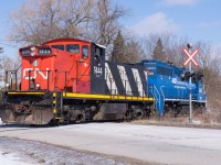 CN 1444 and GMTX 2695 ease across Whitelaw Road outside of Guelph as they head back towards Preston.  