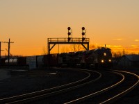 CN 434 is seen ducking under the signals at Paris Junction with CREX 1507 in the lead, they are beginning their set off and lift at the junction as the last light of the day drops away.