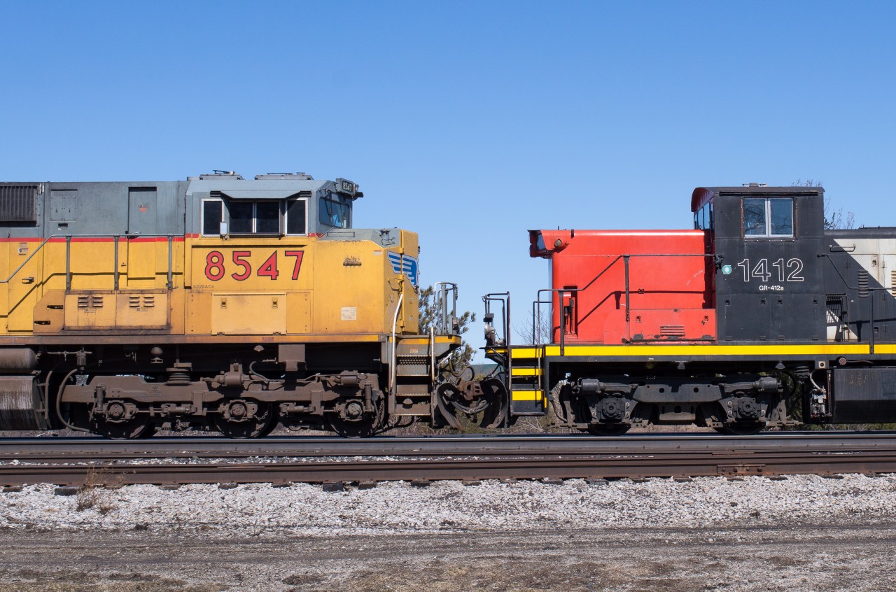 Here is a pairing that I didn't think I would ever come across trackside.  UP 8547 and CN 1412 stare each other down on CN 385.