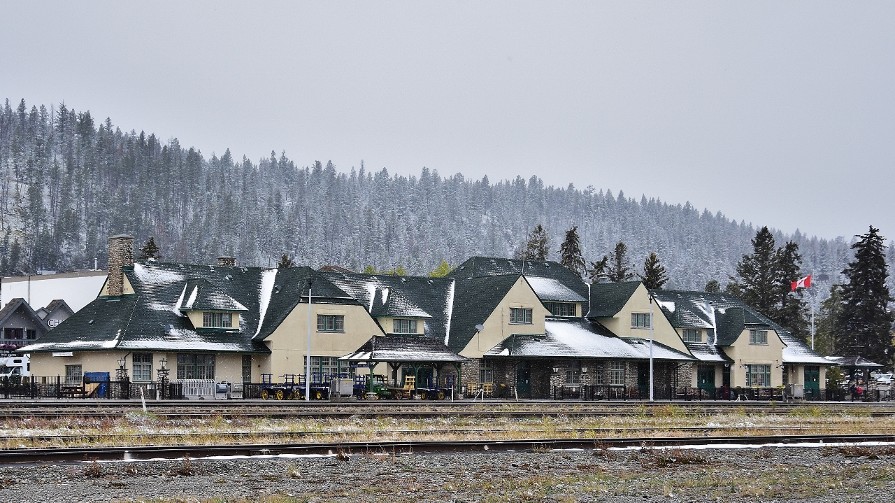 An unusual pause in rail traffic allowed this view of the the beautifully restored Jasper station 
 
 
 This angle of view is normally blocked by CN arrivals / departures and / or blocks of rail cars.
 
 
  At Jasper Alberta on a chilly late summer afternoon ( +1c  ) Sept 12, 2018 afternoon; image by S Danko
 
 
 what's interesting
 
 
  The Grand Trunk Pacific Railway  ( GTP ) founded Fitzhugh Alberta in 1911 by the by placing a siding at this location ( Fitzhugh was a GTP Vice President)
  
 
  In 1913 the GTP renamed Fitzhugh  to Jasper, recognizing the importance of nearby Jasper House founded 1913 by the North West Company
  
  
 Present Jasper station built by the CNR circa 1926
 
 
 The station was declared a heritage railway station by the federal government in 1992.
 
 
 Jasper station currently owned by Parks Canada,  tenants include National Car Rental,  Hertz car rental (since closed), Rocky Mountainer RMR, VIA Rail and at the time image captured Greyhound, who quit all routes west of Sudbury October 31, 2018