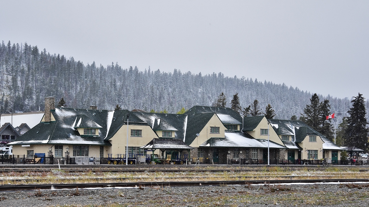 An unusual pause in rail traffic allowed this view of the the beautifully restored Jasper station 
 
 
 This angle of view is normally blocked by CN arrivals / departures and / or blocks of rail cars.
 
 
  At Jasper Alberta on a chilly late summer afternoon ( +1c  ) Sept 12, 2018 afternoon; image by S Danko
 
 
 what's interesting
 
 
  The Grand Trunk Pacific Railway  ( GTP ) founded Fitzhugh Alberta in 1911 by the by placing a siding at this location ( Fitzhugh was a GTP Vice President)
  
 
  In 1913 the GTP renamed Fitzhugh  to Jasper, recognizing the importance of nearby Jasper House founded 1913 by the North West Company
  
  
 Present Jasper station built by the CNR circa 1926
 
 
 The station was declared a heritage railway station by the federal government in 1992.
 
 
 Jasper station currently owned by Parks Canada,  tenants include National Car Rental,  Hertz car rental (since closed), Rocky Mountainer RMR, VIA Rail and at the time image captured Greyhound, who quit all routes west of Sudbury October 31, 2018