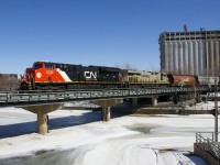 A second section of CN 527 (L52721-26) is entering the Port of Montreal with 51 grain cars. Power is fairly new ET44AC CN 3133 and leased ES44AC CREX 1519. With temperatures still below freezing, the Lachine Canal has not begun to thaw out yet.