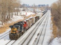 CN X321 is about to enter Taschereau Yard to wye their power, after running from Southwark Yard with GECX 7388 and CN 8902, both running long hood forward.
