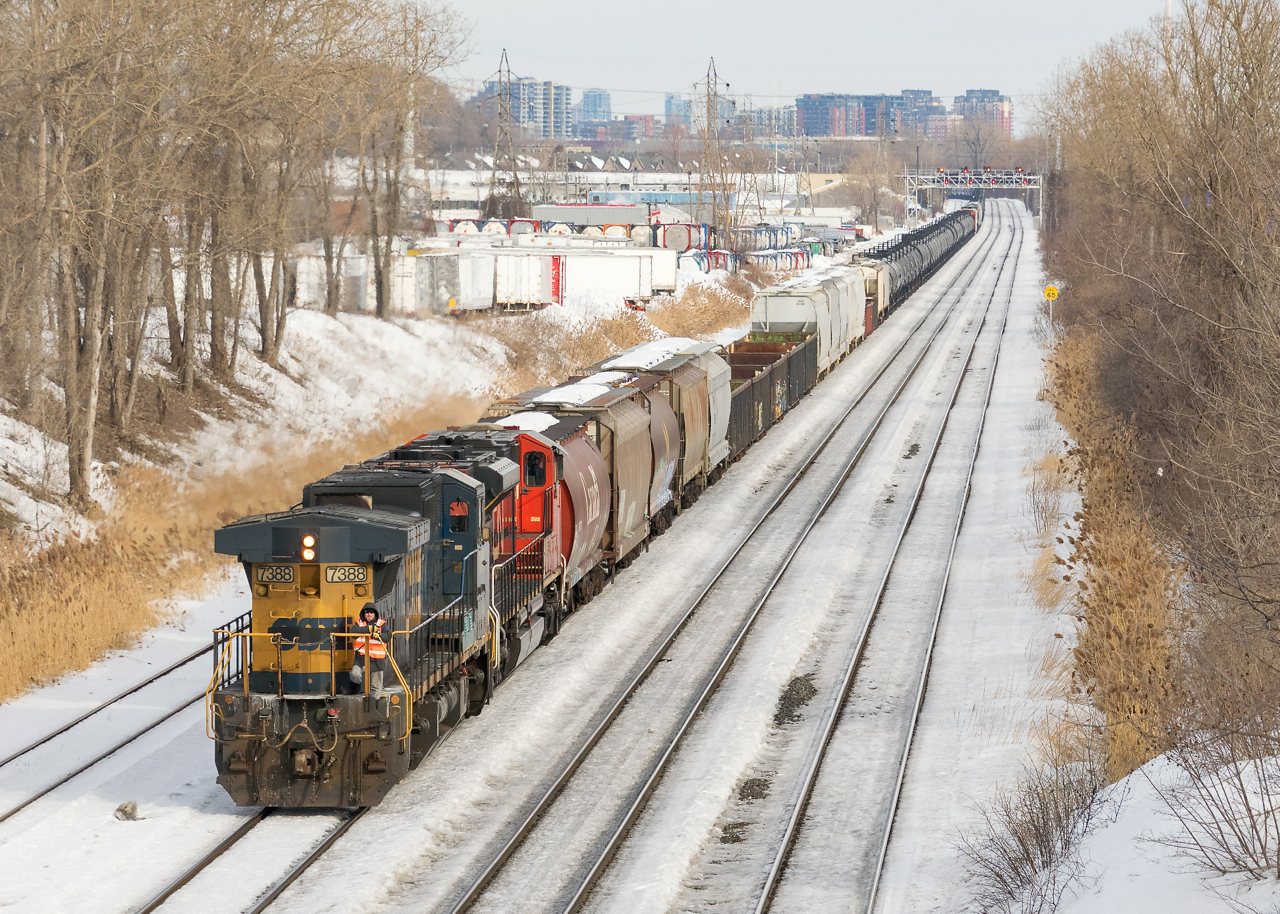 CN X321 is about to enter Taschereau Yard to wye their power, after running from Southwark Yard with GECX 7388 and CN 8902, both running long hood forward.