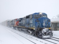 CN 372 has 91 autoracks and IC 2462, CN 5739 & GECX 7353 for power as it passes through Dorval on a very snowy morning.