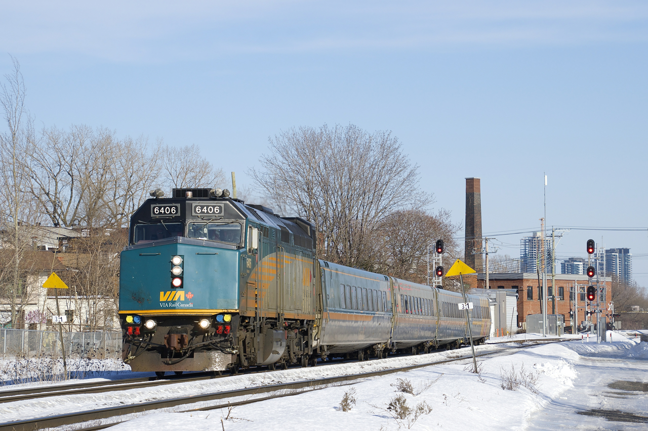 VIA 69 heads west on the north track of CN's Montreal Sub with VIA 6406 and four LRC cars.
