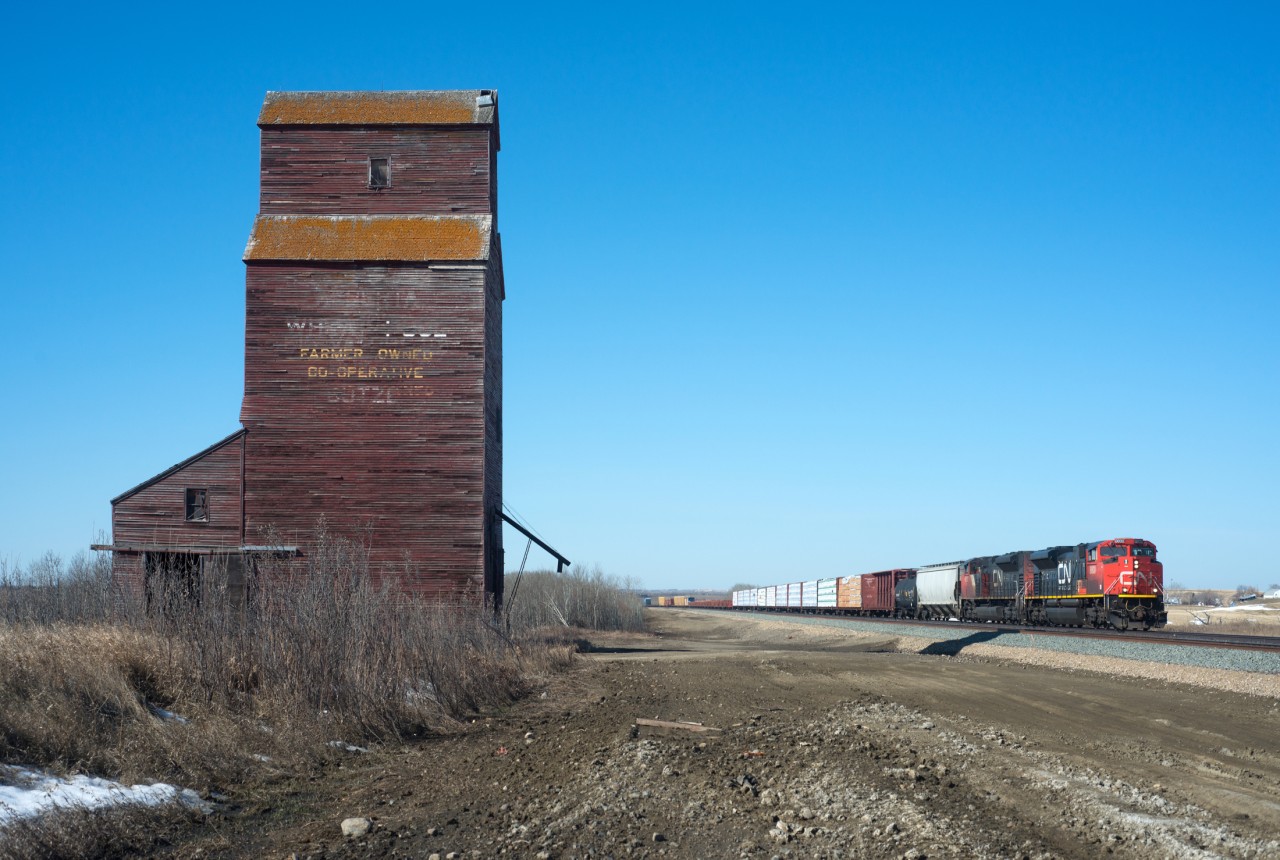 The elevator at Butze is still standing next to the recently completed double-tracking of this portion of the Wainwright sub. Butze is no longer an active station name on CN. Originally part of GTP's alphabetical station name system it is situated between Artland SK and Chauvin AB. The recent double track project has again given this spot a name on the timetable but unfortunately it dose not adhere to the alphabetical tradition. The new crossovers here are now called "CN Nielsen".