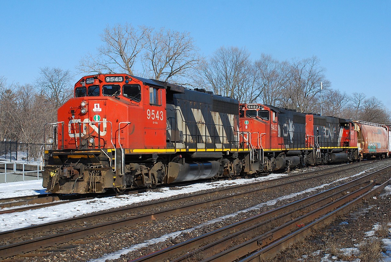 CN 580 arrives back in Brantford with 15 cars off of the Hagersville Subdivision.  Decades ago a set of three GP40-2L(W)s powered high priority trains like the Laser and were as common as dirt on the mainline, but now they've been relegated to lowly local duty.  On a bright sunny winter day they still look good being over 40 years old.  Is 9543 still in original paint?  Pretty impressive if it is.