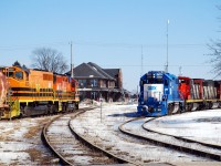 Hot times at Stratford West.  GEXR 581 comes off the GEXR Goderich Sub. and enters the CN Guelph Sub. as CN L568 sets off cars in the yard for the Goderich-Exeter.