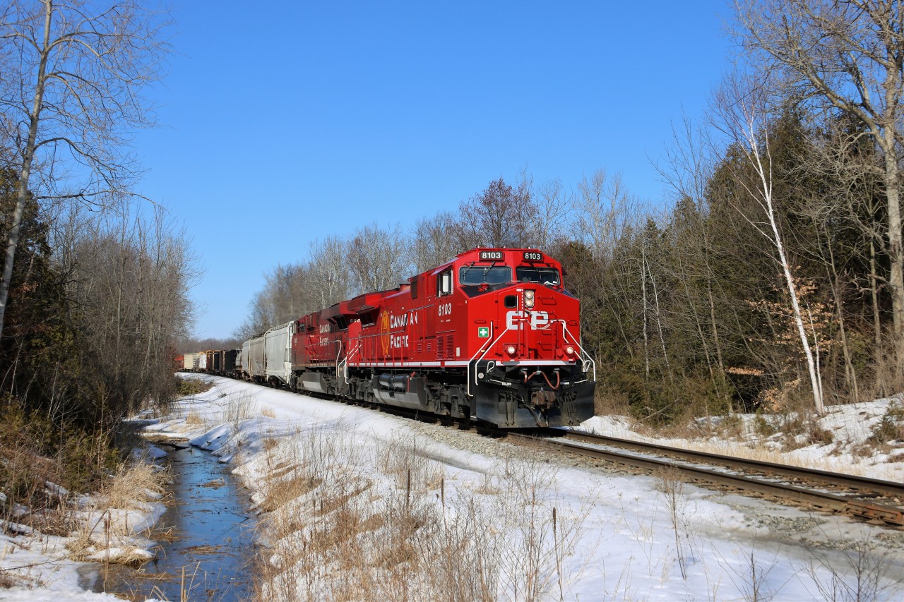 Former CP 9608, now freshly rebuilt and repainted to CP 8103, leads CP 8865 southbound down the Hamilton sub on a beautiful sunny winter afternoon as it crosses the Milburough Line