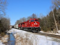 Former CP 9608, now freshly rebuilt and repainted to CP 8103, leads CP 8865 southbound down the Hamilton sub on a beautiful sunny winter afternoon as it crosses the Milburough Line