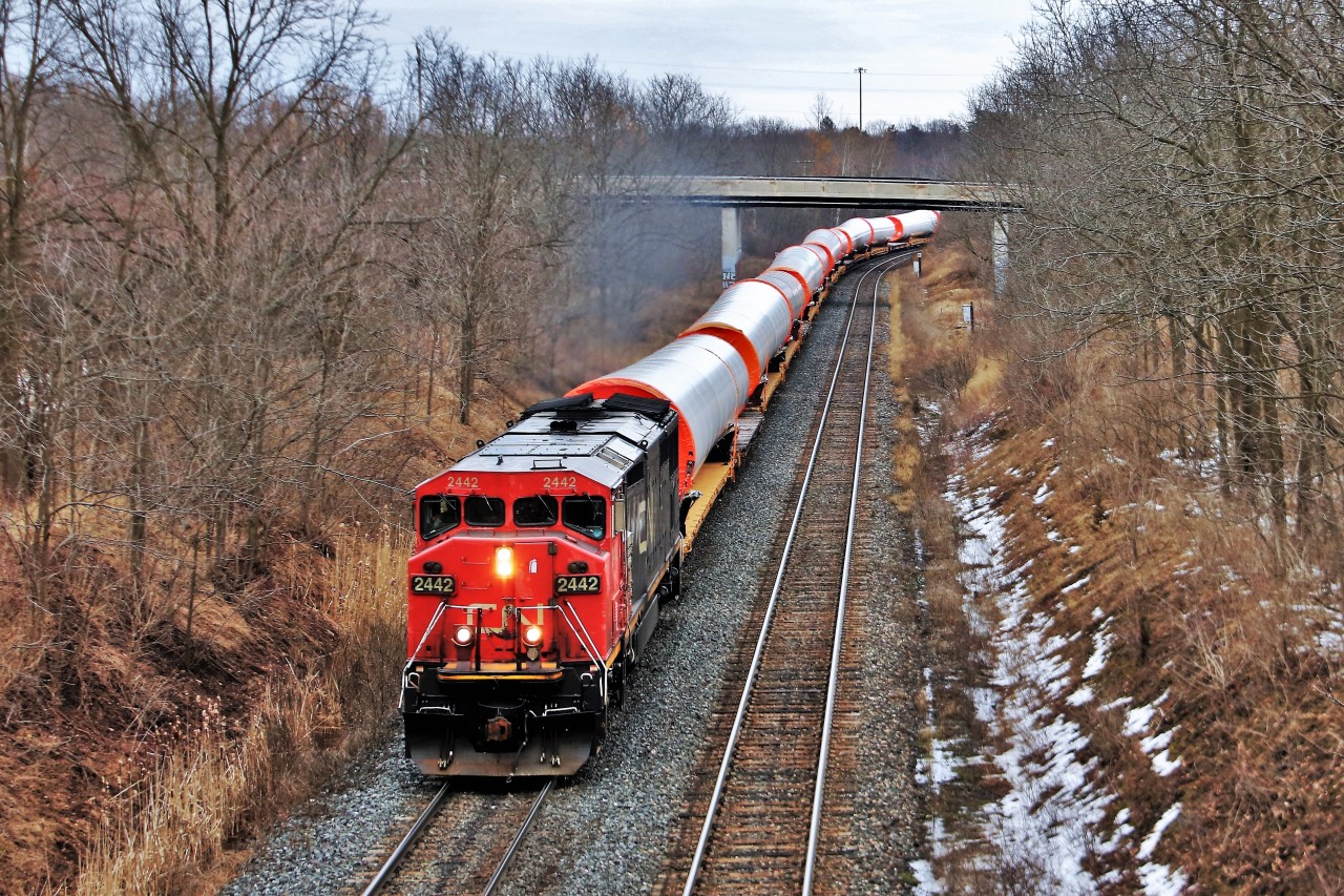 CN 2442 runs full power as it heads up the Dundas sub at mile one hauling 388 axles of 3085mm pipe. There was plenty of chatter on the radio on needing pushers to get it up the grade in to Copetown and it indeed was true as it stalled out at mile 9.5.