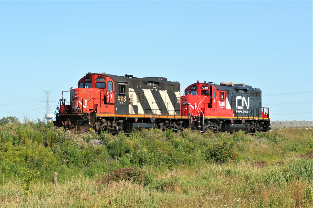 CN GP9RM's 7246 and 4118 roll westbound through Mansewood on the Halton Subdivision. At the time, 7246 was just freshly repainted and certainly looked good in the evening light.