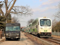 After making its stop at the Guelph GO station, GO 312 slowly runs along Kent Street on its way to Kitchener as the UPS truck makes a delivery. 