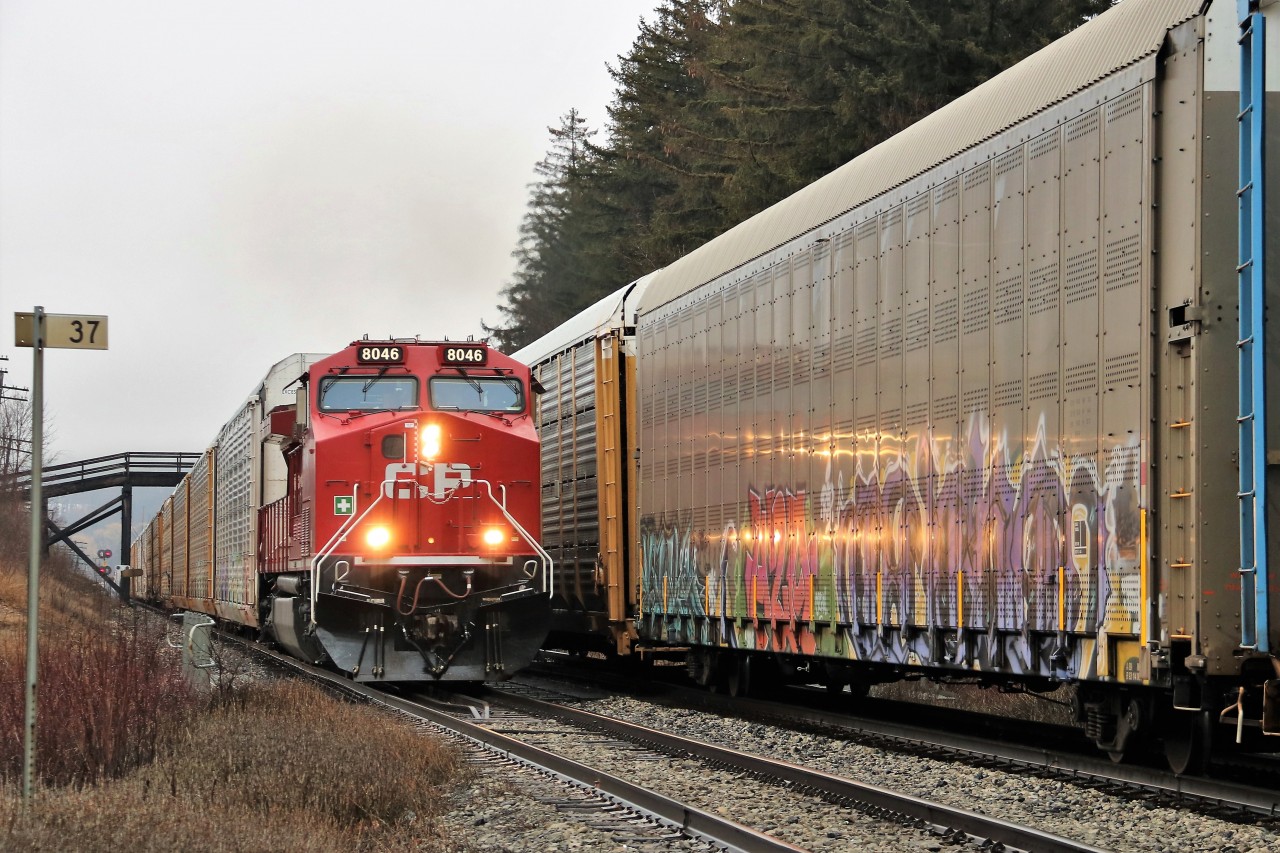 CP 147 led by the lone CP 8046 (former CP 9531) catches the tail end of CP 246 at mile 37 on the Galt sub. The lights illuminate the graffiti very nicely.