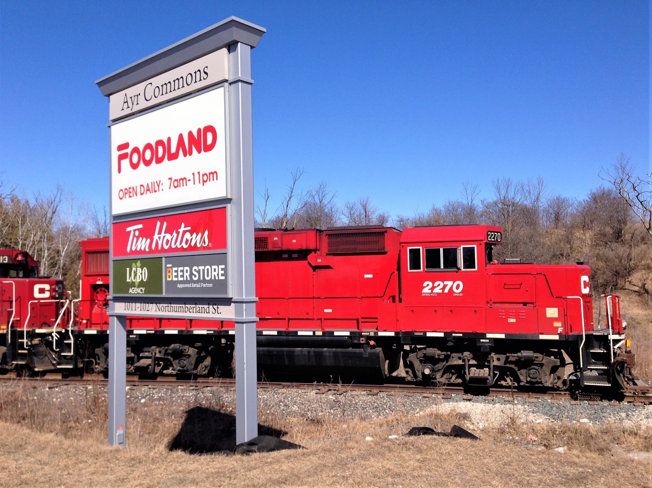 Literally a sign of the changing times along the Ayr Pit Spur as GP20C-ECO 2270, GP38-2 3113 and GP20C-ECO 2263 are seen attempting to lift cars from the remaining customer on the trackage.