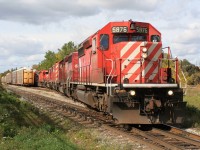 An eastbound Canadian Pacific train is viewed lifting loaded auto racks in Galt on the Waterloo Subdivision near Hespeler Road that were sitting on track WG–32 North. This area was drastically changed with the installation of the Hesepler Road overpass years later.

The consist includes; SD40-2 5876, SD40-2 5788, SD40-2F 9012 and SD40-2’s 5990, 5867 and 5763. Once the lift is completed, the units and cars will return to their waiting train by the Galt station and continue the journey east to Toronto. October 10, 2009.
