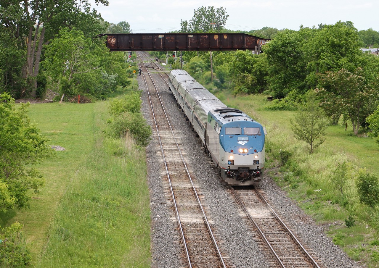 VIA/Amtrak's Maple Leaf passes under the abandoned NS&T bridge in Merritton, Ontario. I believe this bridge has since been removed.