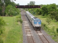 VIA/Amtrak's Maple Leaf passes under the abandoned NS&T bridge in Merritton, Ontario. I believe this bridge has since been removed. 