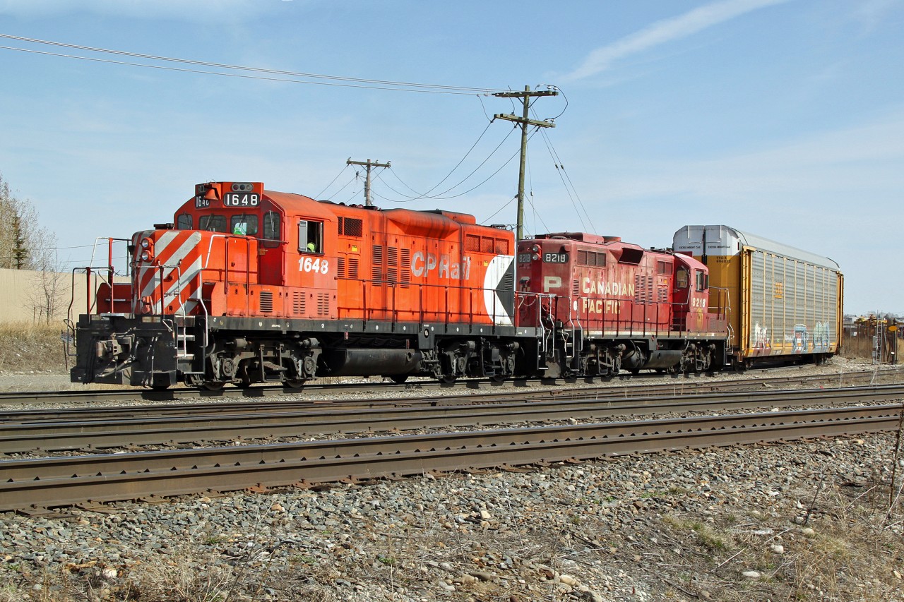 in 2012 GP9u CP 1648 and 8218, long since retired (2014 and 2015 respectively) are switching auto racks into the Ogden Road yard.