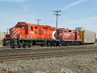 in 2012 GP9u CP 1648 and 8218, long since retired (2014 and 2015 respectively) are switching auto racks into the Ogden Road yard. 