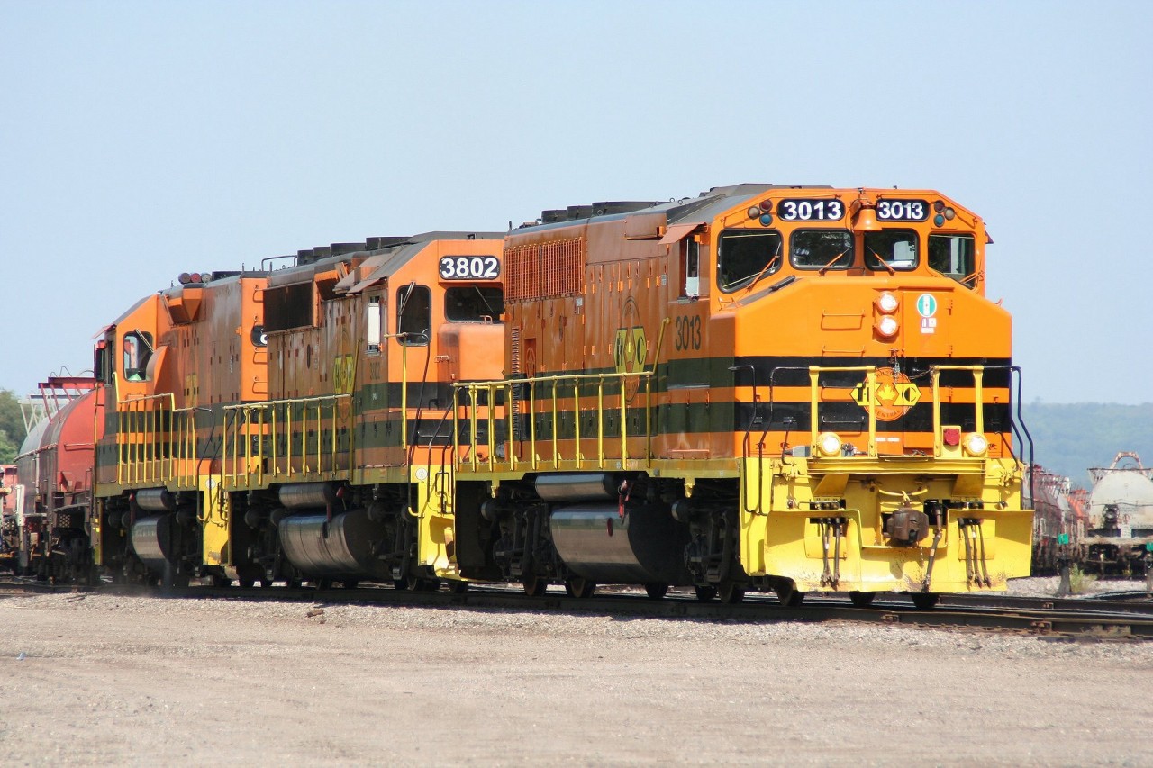 Huron Central GP40-2(W) 3013 works cars in the yard at Sault Ste. Marie along with GP40-2 3802 and RM-1 road slug 802.
