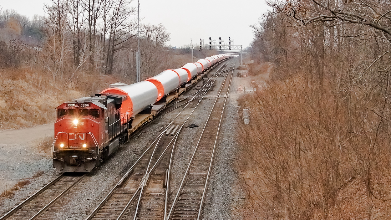 A solo CN 2500 leads wind turbine columns on the westward march to Ontario, as they embark on their journey from Quebec to Texas. One of my favourite types of units to see leading - the comfort cab dash 9.
