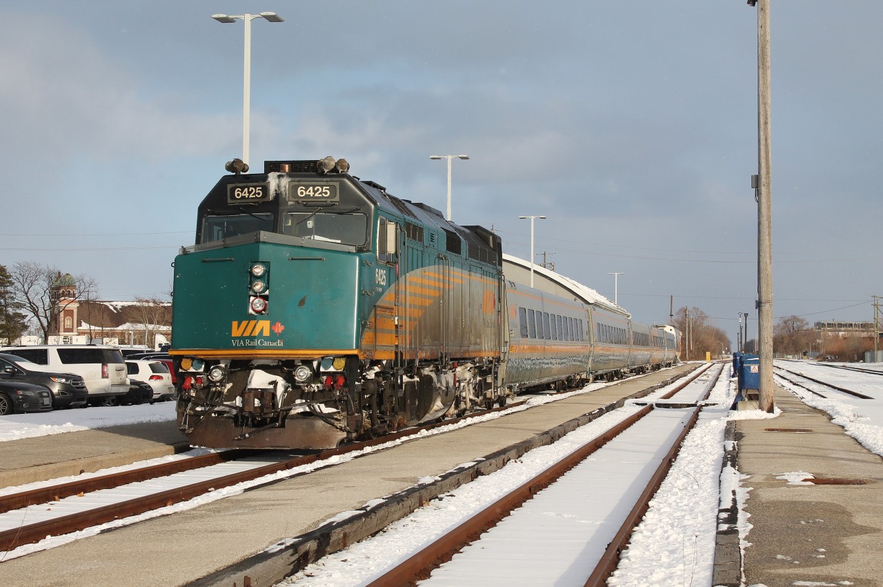 VIA 73 offloads passengers at Windsor (Walkerville) Station in the historic Walkerville neighbourhood of Windsor. Hiram Walker's distillery is located next door to the station and is where Canadian Club Whiskey is produced. At one time the Chatham Sub went all the way to the waterfront but the tracks end just behind the camera with ETR still maintaining a spur across Walker Road to serve Hiram Walker's.