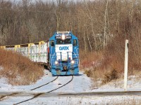 CN L542 heads south on the Fergus Spur after spending a couple of hours working around Guelph. They're about to cross a private driveway that connects a couple of houses to the highway. 