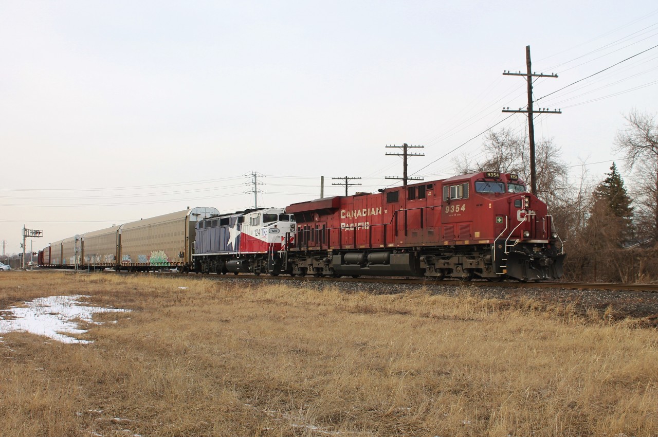 CP 140 departs Windsor Yard after making a set off and a lift. Trailing is TRE 124 which had been involved in a severe and unfortunately fatal grade crossing accident with a dump truck in Fort Worth, Texas. It was on its way to be repaired (I presume at CAD but I'm not 100% on that).