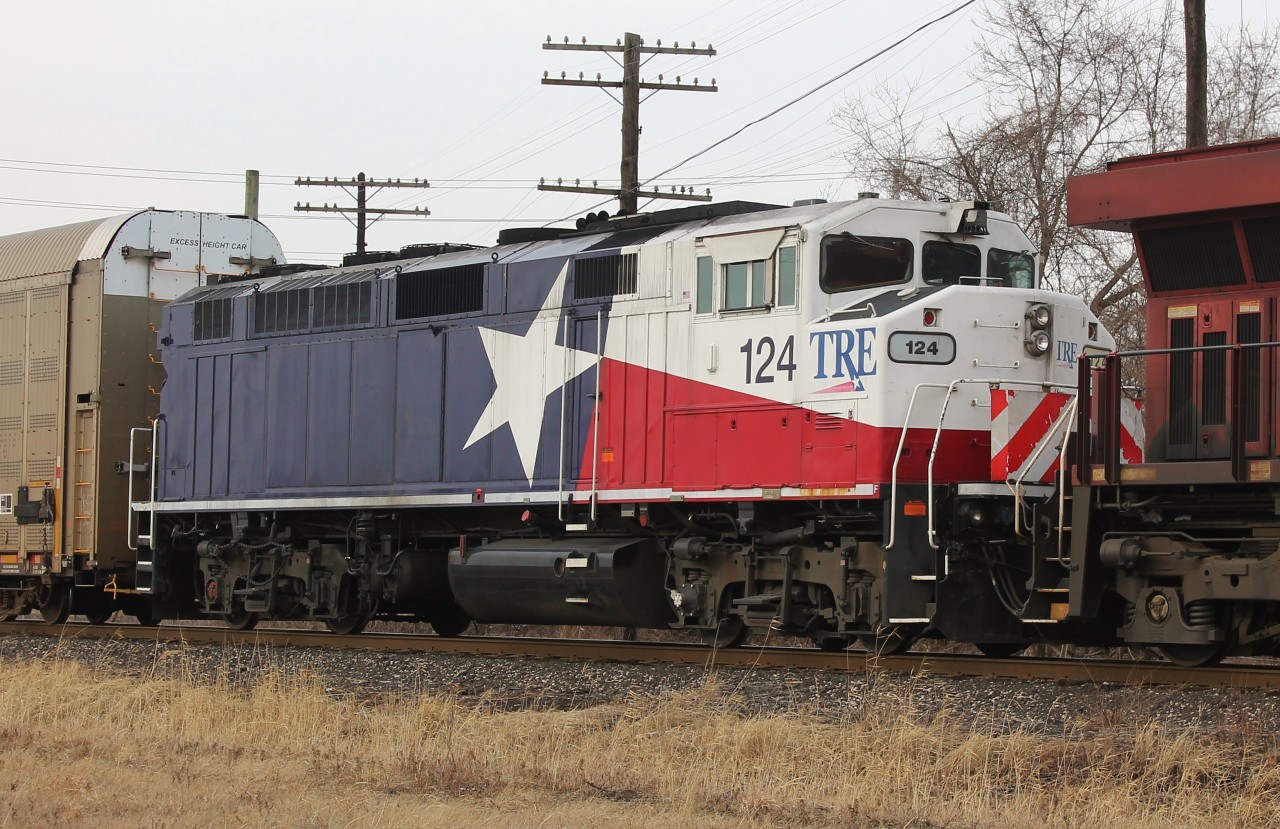 This is a roster of TRE 124 as it heads dead-in-tow behind CP 9354 to Toronto. I believe this is an ex GO F59PH. The unit was involved in an unfortunate fatal grade crossing accident with a dump truck in August 2018 in Fort Worth, Texas. After comparing the unit to photos at the crash site it has undergone some repair since the wreck but is still being sent to another shop for heavier repairs. The bulk of the damage is on the conductor side of the unit and not really visible from this angle but if you look closely you can tell the shield on the front is scuffed up and the hand rail is damaged. I hope the TRE crew was able to recover from the incident.