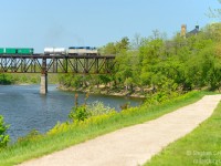 CP's "Weed Train" (No, not that kind of weed) passes through the quaint town of Galt, Ontario passing over the Grand River. D&H 7303 made this a fan favourite for the second year in a row (7304 in the year prior). This nice scene has already changed as pedestrian lights are being installed all along this path in this very spot. Not sure if they'll add to the scene or take away, but one thing is certian: change is always just around the corner. <br><br>This train was operated by Davey Tree Services - makes me wonder if the D&H unit was chosen to distance CP from the application of herbacides, always a controversial subject in this day and age. We'll know if it happens again for the third year in a row  this spring.