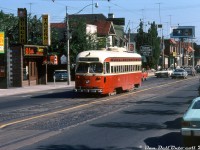 During the last week of regular streetcar operation on Mount Pleasant Avenue, TTC A8-class PCC 4527 heads northbound on the Mount Pleasant route, approaching Eglinton Avenue and the route's northern terminus at Eglinton Loop. It's Thursday July 22nd 1976, and after the curtain falls on streetcar operation the route would switch to trolleybus operation as the Route 74 a year later (diesel shuttle buses would run for an interim period during a bridge reconstruction along the route, that was part of the decision to end streetcar service). The last full day of service along Mount Pleasant was a few days later on Sunday July 25th 1976, and included a Peter Witt streetcar charter. The 4500-series A8's were the newest cars on the system (built 1951) and based out of Wychwood (St. Clair) carhouse, which operated the Mount Pleasant route as well as others including St. Clair.<br><br><i>J. Bryce Lee photo, Dan Dell'Unto collection.</i><br><br><i>More along Mount Pleasant:</i><br>Nearby at Manor Rd.: <a href=http://www.railpictures.ca/?attachment_id=31154><b>http://www.railpictures.ca/?attachment_id=31154</b></a><br>At Millwood Avenue: <a href=http://www.railpictures.ca/?attachment_id=32380><b>http://www.railpictures.ca/?attachment_id=32380</b></a><br>Further south at Merton: <a href=http://www.railpictures.ca/?attachment_id=30929><b>http://www.railpictures.ca/?attachment_id=30929</b></a>