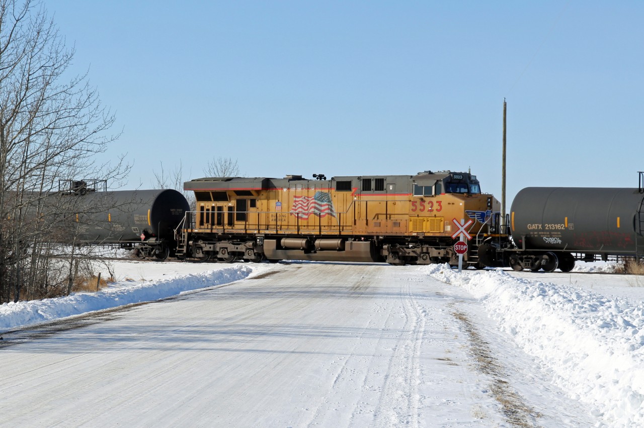 Mid train help on this westbound CP oil train is provided by ES44AC UP 5523.  Viewed crossing TWP Rd 540 at mile 158 of CP's Scotford Sub.