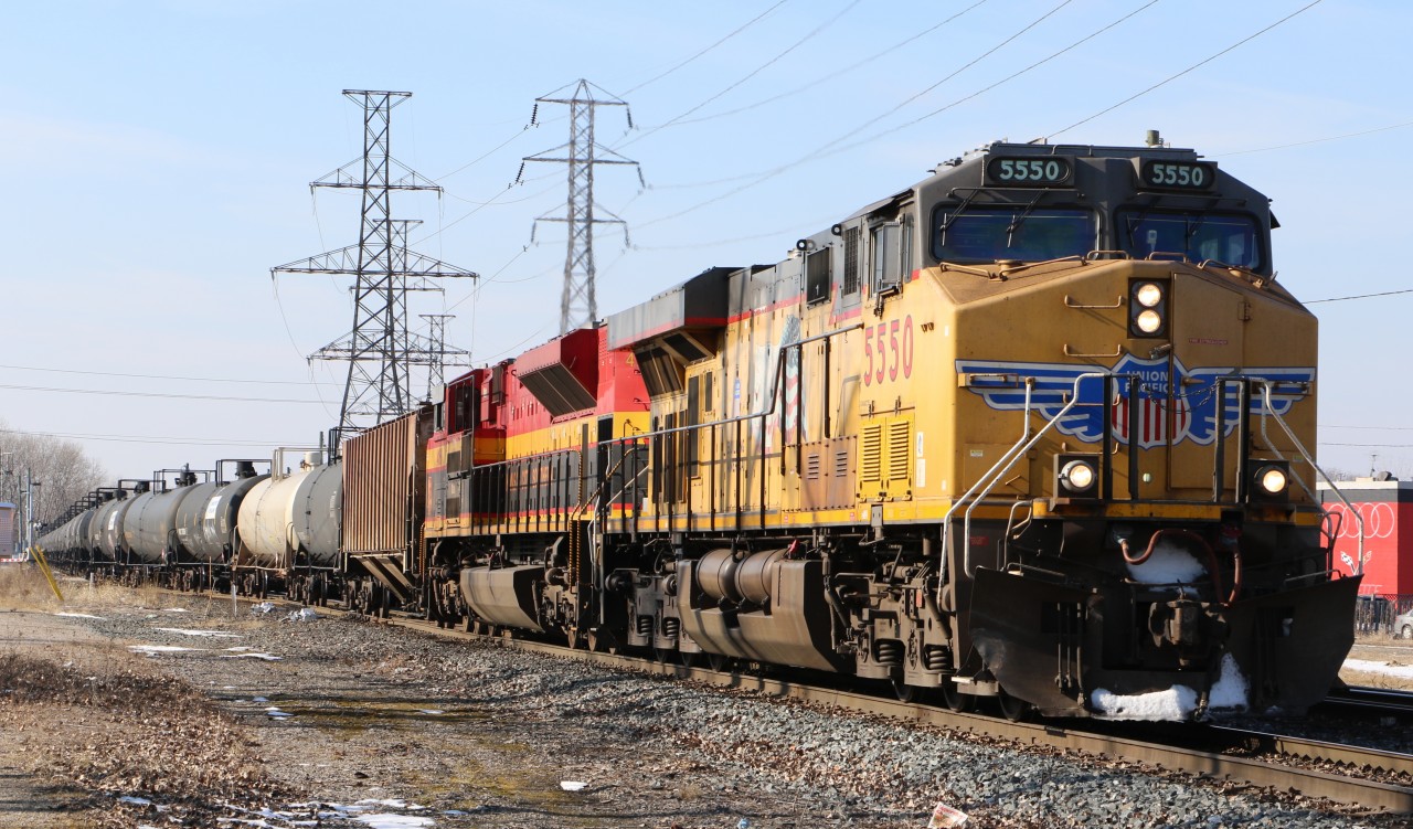 UP 5550 lead's a colorful CP 646 east in Windsor.