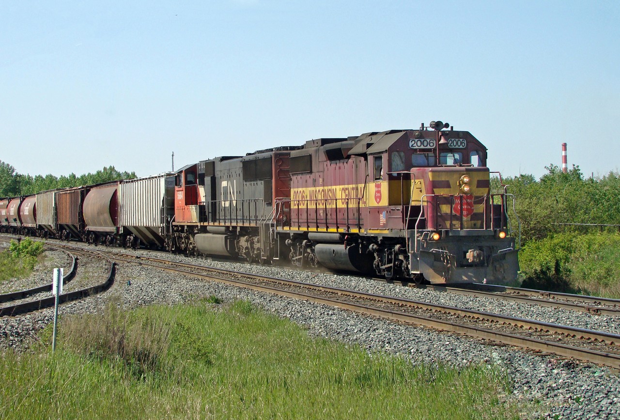 Have not seen this paint scheme in this parts for a while.  Back in 2009 GP38-2 WC 2006 and SD75I CN 5664 approach Bretville Junction on CN's Camrose Sub.