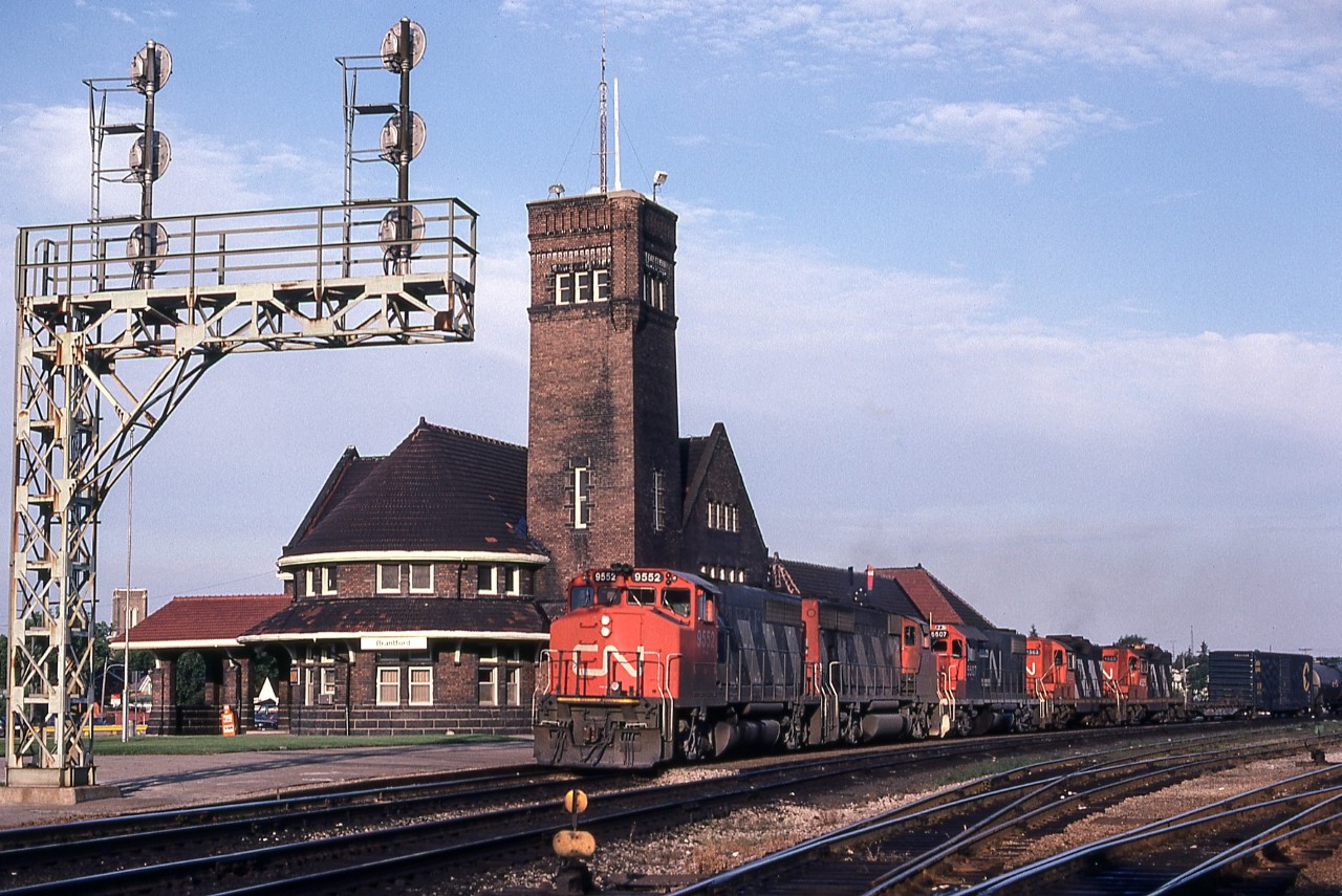 CN 9552 is waiting next to the VIA station in Brantford, Ontario on August 14, 1982.